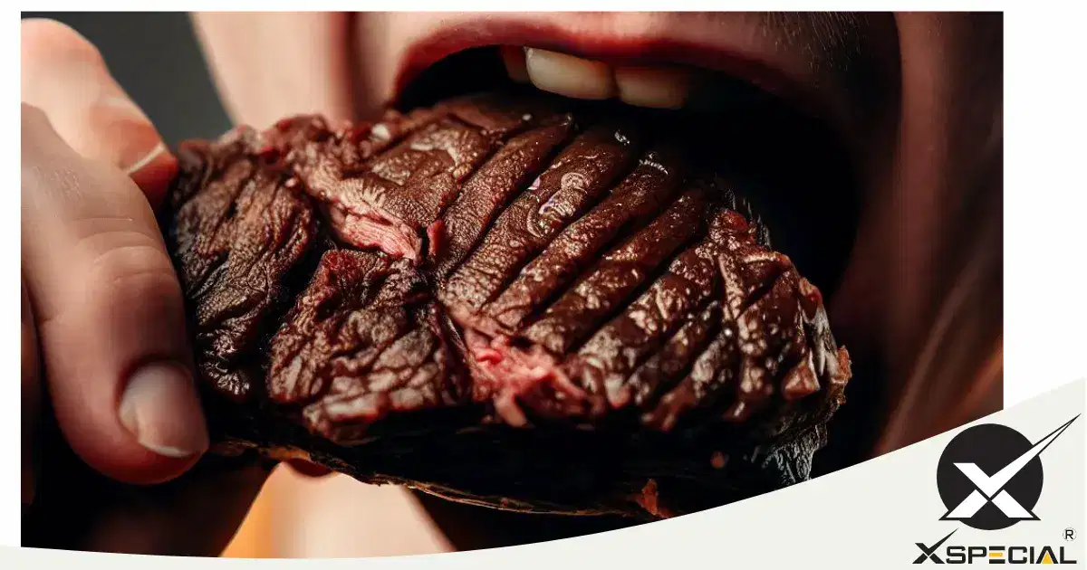 A meat lover is savoring a steak.